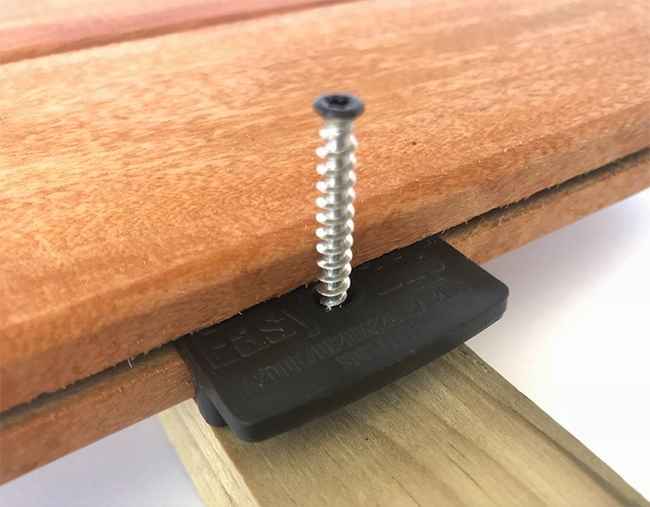 image of EasyClip hidden deck fastner and screw used to provide a smooth and safe deck surface