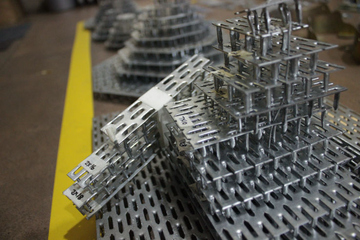 a photo at Alternative Structures of our anti-split plates stacked for display 